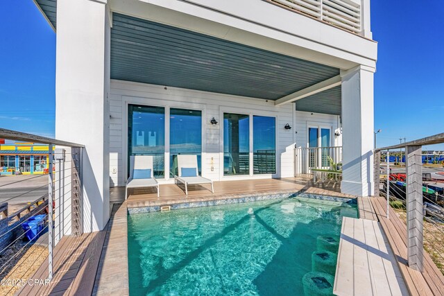 12401 Front Beach Rd, Panama City Beach, FL 32407 - rear view of property featuring an outdoor pool and a balcony