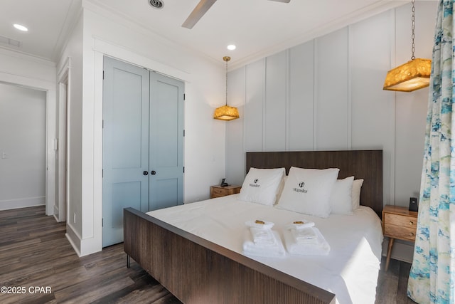 12401 Front Beach Rd, Panama City Beach, FL 32407 - bedroom with recessed lighting, dark wood-style floors, a closet, and crown molding