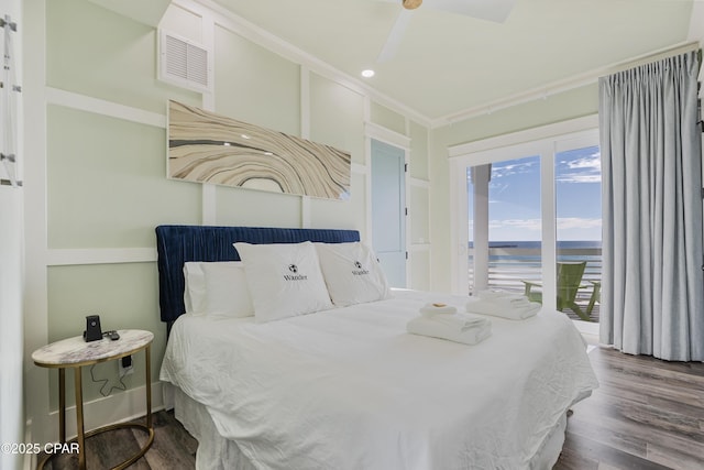 12401 Front Beach Rd, Panama City Beach, FL 32407 - bedroom featuring visible vents, a water view, ceiling fan, wood finished floors, and access to outside