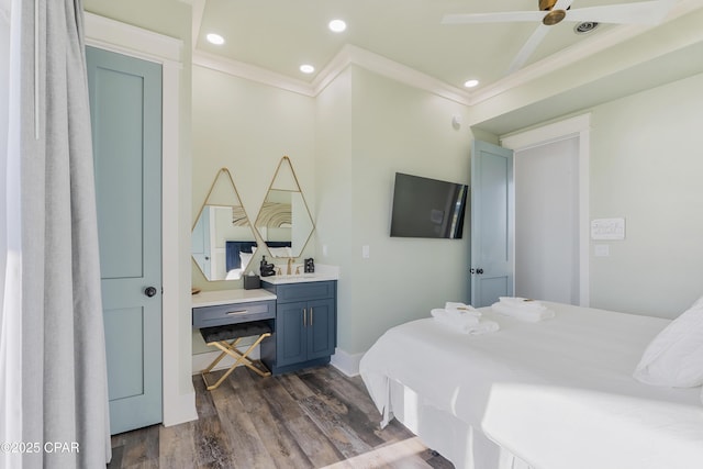 12401 Front Beach Rd, Panama City Beach, FL 32407 - bedroom with dark wood-type flooring, ornamental molding, recessed lighting, a sink, and baseboards