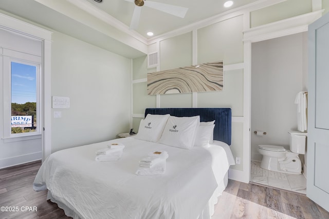 12401 Front Beach Rd, Panama City Beach, FL 32407 - bedroom with wood finished floors, recessed lighting, visible vents, and connected bathroom