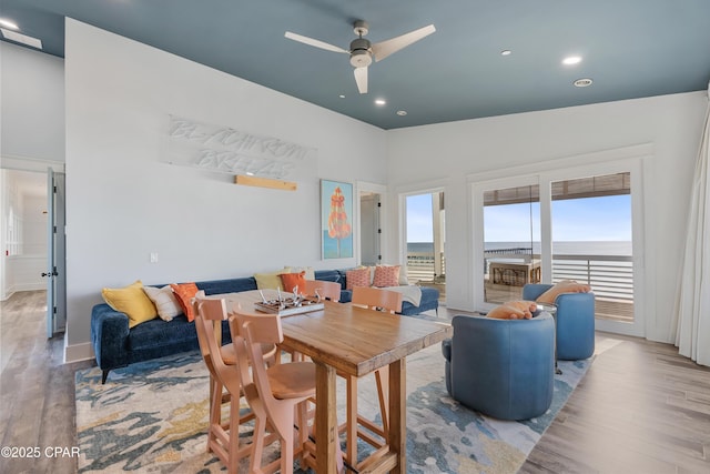 12401 Front Beach Rd, Panama City Beach, FL 32407 - dining space with ceiling fan, recessed lighting, a towering ceiling, and wood finished floors