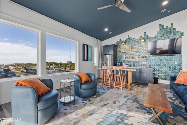 12401 Front Beach Rd, Panama City Beach, FL 32407 - living area with bar area, a ceiling fan, and vaulted ceiling