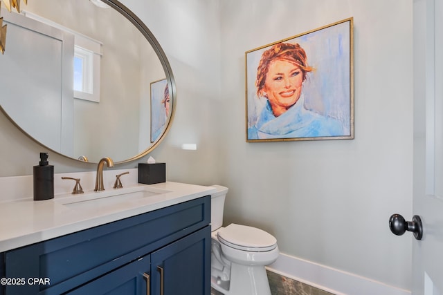 12401 Front Beach Rd, Panama City Beach, FL 32407 - half bathroom with toilet, vanity, and baseboards