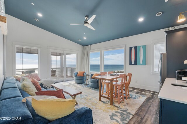 12401 Front Beach Rd, Panama City Beach, FL 32407 - living room featuring a wealth of natural light, dark wood-type flooring, vaulted ceiling, and ceiling fan