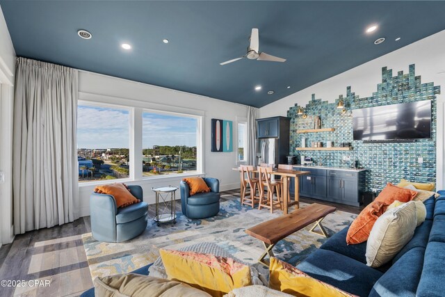 12401 Front Beach Rd, Panama City Beach, FL 32407 - living room with indoor wet bar, a ceiling fan, light wood finished floors, recessed lighting, and vaulted ceiling