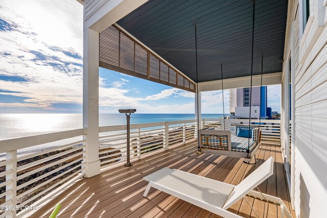 12401 Front Beach Rd, Panama City Beach, FL 32407 - wooden deck featuring a water view and a beach view