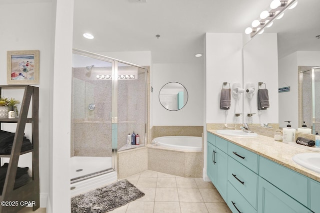 9902 S Thomas Dr Unit 629, Panama City, FL 32408 - bathroom featuring a garden tub, a stall shower, a sink, tile patterned floors, and double vanity
