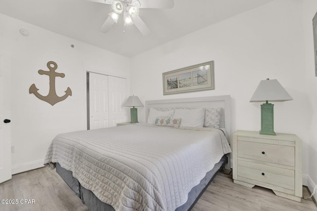 9902 S Thomas Dr Unit 629, Panama City, FL 32408 - bedroom with wood finished floors, a closet, a ceiling fan, and baseboards