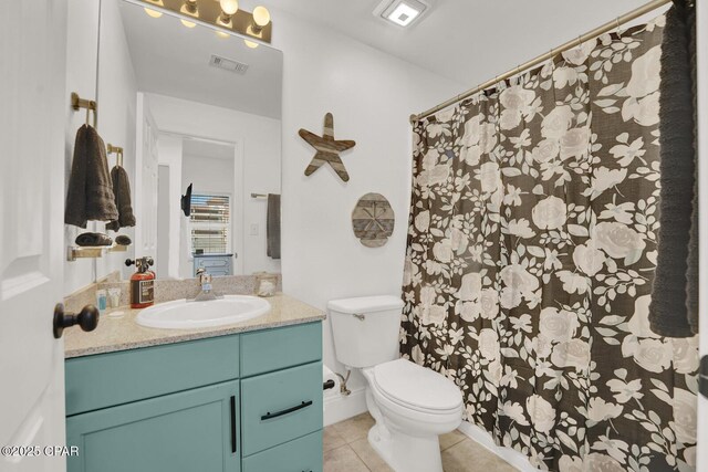 9902 S Thomas Dr Unit 629, Panama City, FL 32408 - full bathroom featuring toilet, vanity, tile patterned flooring, and visible vents