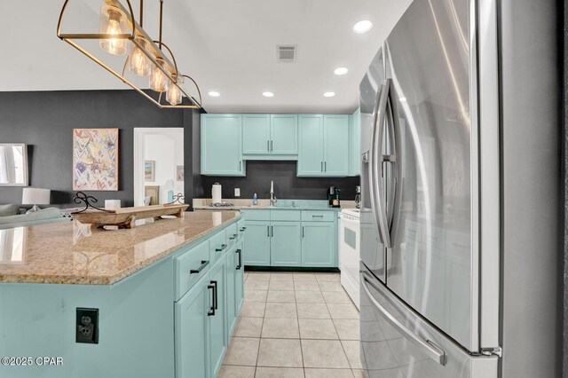 9902 S Thomas Dr Unit 629, Panama City, FL 32408 - kitchen featuring visible vents, recessed lighting, stainless steel refrigerator with ice dispenser, light tile patterned flooring, and a sink