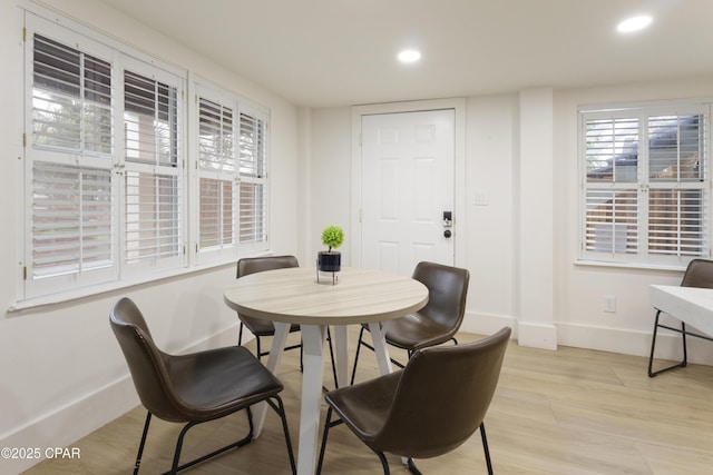 dining area with baseboards and recessed lighting