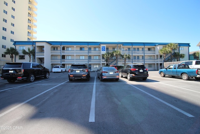 8610 Surf Dr Unit 306, Panama City Beach, FL 32408 - view of apartment building / complex featuring uncovered parking