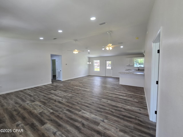 4610 Pineview Dr, Marianna, FL 32446 - unfurnished living room with lofted ceiling, a ceiling fan, dark wood finished floors, and recessed lighting