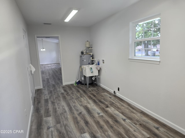 4610 Pineview Dr, Marianna, FL 32446 - laundry room featuring dark wood-style floors, electric water heater, and washer hookup