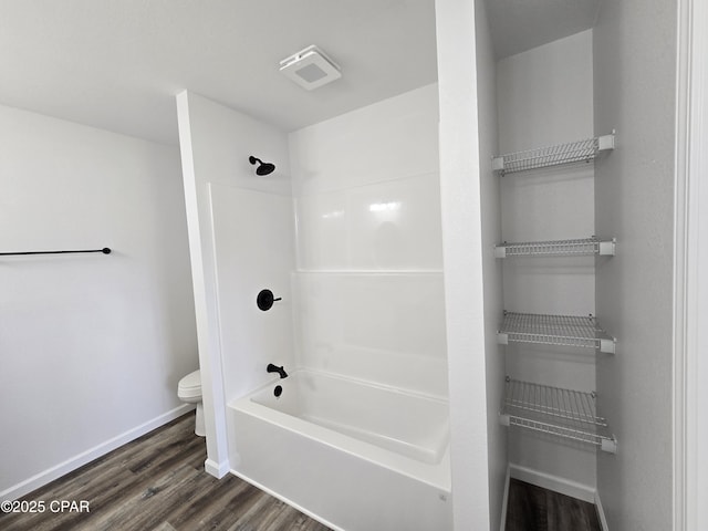 4610 Pineview Dr, Marianna, FL 32446 - bathroom featuring wood finished floors and washtub / shower combination