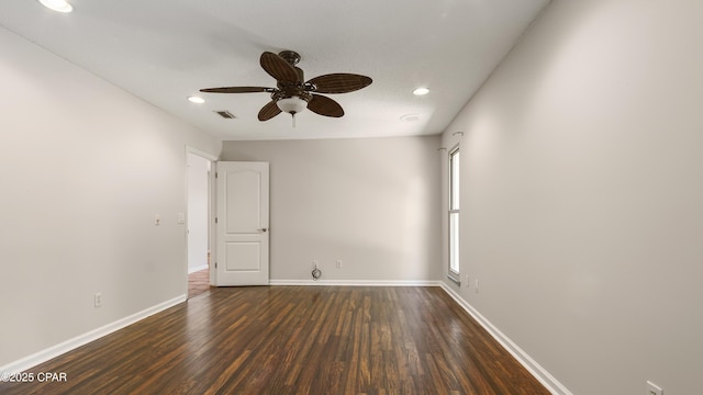 empty room featuring baseboards, recessed lighting, dark wood-style floors, visible vents, and ceiling fan