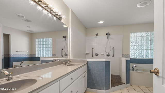 full bathroom featuring a sink, visible vents, a tile shower, and tile patterned flooring