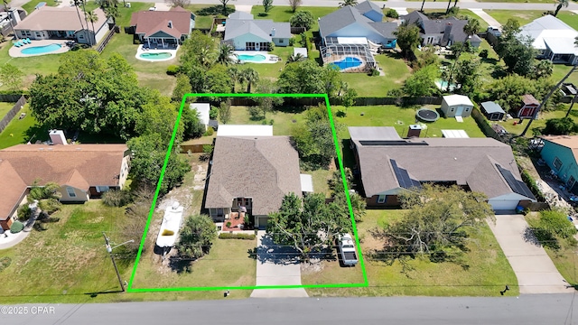 birds eye view of property with a residential view