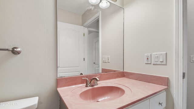half bath with toilet and vanity
