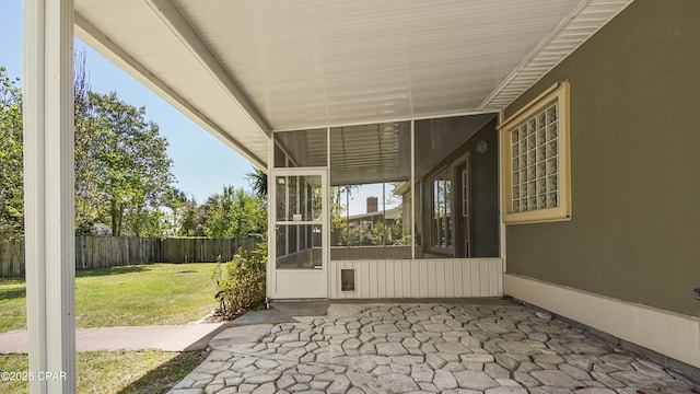 view of patio / terrace with a fenced backyard and a sunroom