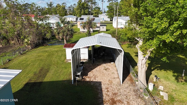 1314 Mcclelland Ave, Port St Joe, FL 32456 - view of yard featuring an outbuilding, a detached carport, and a residential view