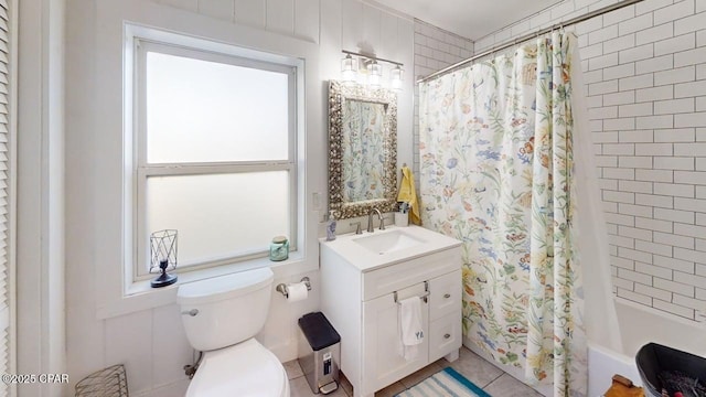 1314 Mcclelland Ave, Port St Joe, FL 32456 - full bath featuring vanity, toilet, shower / bath combo with shower curtain, and tile patterned floors