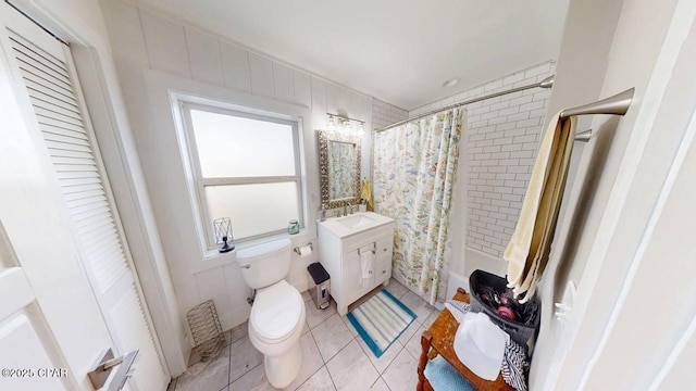 1314 Mcclelland Ave, Port St Joe, FL 32456 - full bath with toilet, vanity, shower / bath combo with shower curtain, a closet, and tile patterned flooring