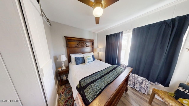 1314 Mcclelland Ave, Port St Joe, FL 32456 - bedroom with wood finished floors and ceiling fan