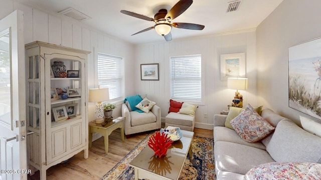 1314 Mcclelland Ave, Port St Joe, FL 32456 - living area with light wood-type flooring, healthy amount of natural light, ceiling fan, baseboards, and ornamental molding