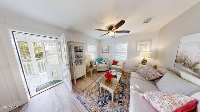 1314 Mcclelland Ave, Port St Joe, FL 32456 - living room featuring light wood-style flooring, ceiling fan, and baseboards