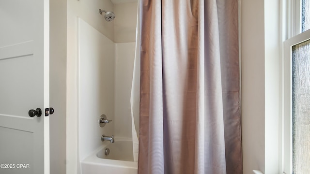 bathroom with shower / bathtub combination with curtain