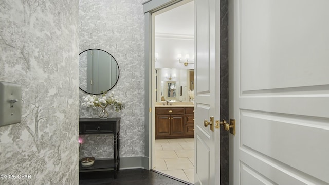 bathroom featuring tile patterned flooring and vanity