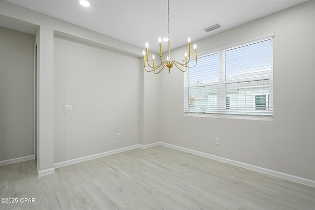 unfurnished room featuring visible vents, baseboards, an inviting chandelier, light wood-style floors, and recessed lighting