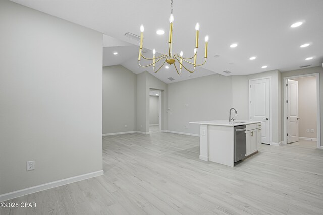 kitchen featuring an inviting chandelier, white cabinetry, a kitchen island with sink, light wood-style floors, and dishwasher