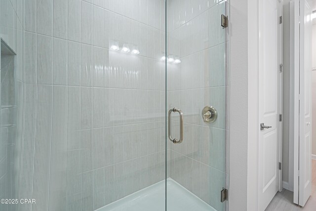 bathroom with a shower stall