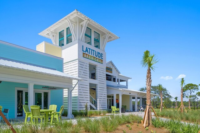 view of front of house featuring a front yard and a water view