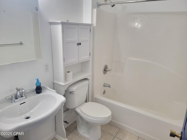 bathroom featuring a sink, tile patterned floors, shower / bathing tub combination, and toilet