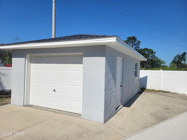 garage featuring fence