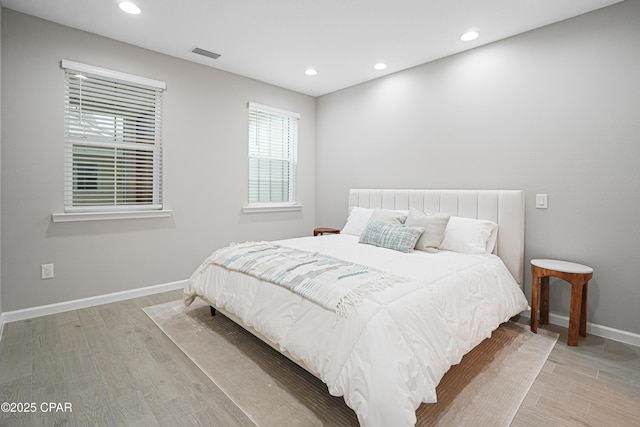bedroom featuring baseboards, visible vents, recessed lighting, and light wood-style floors