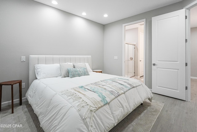 bedroom featuring recessed lighting, light wood-style floors, and baseboards