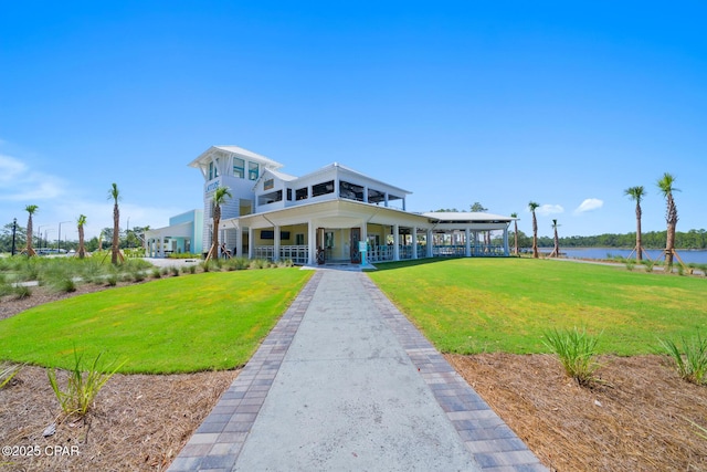 exterior space with a water view and a yard