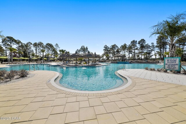 pool featuring a patio area