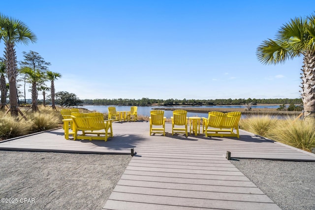 deck featuring a boat dock and a water view