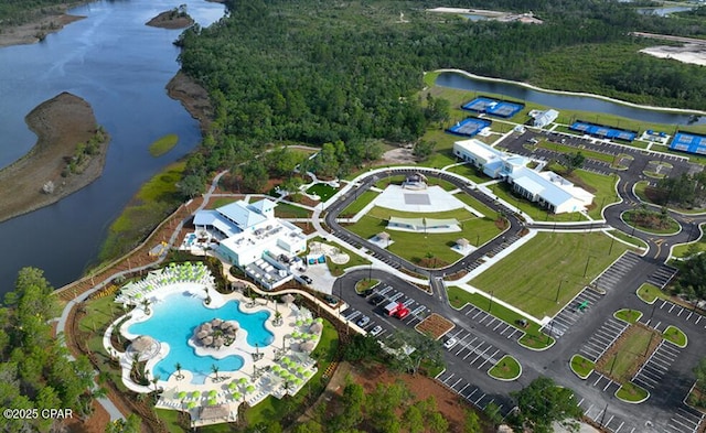 birds eye view of property with a water view