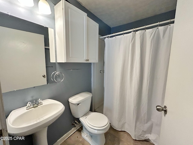 1229 Harrison Ave, Chipley, FL 32428 - bathroom with tile patterned floors, a shower with curtain, a sink, and toilet