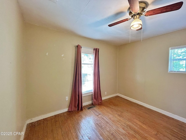 1229 Harrison Ave, Chipley, FL 32428 - spare room featuring visible vents, baseboards, light wood-type flooring, and ceiling fan