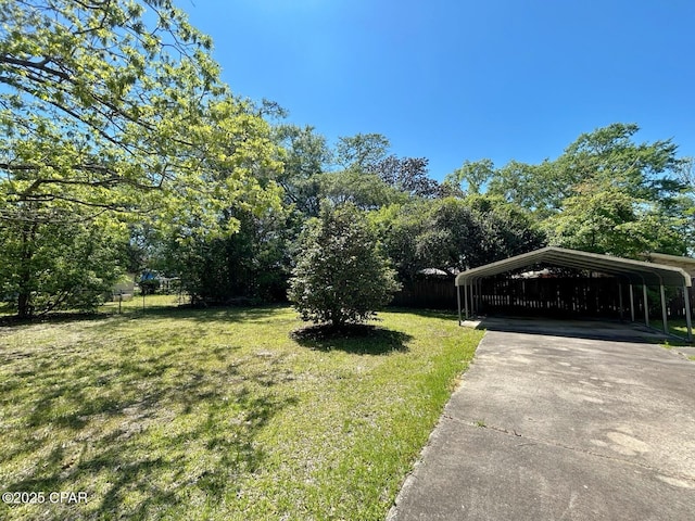 1229 Harrison Ave, Chipley, FL 32428 - view of yard with a carport, fence, and driveway