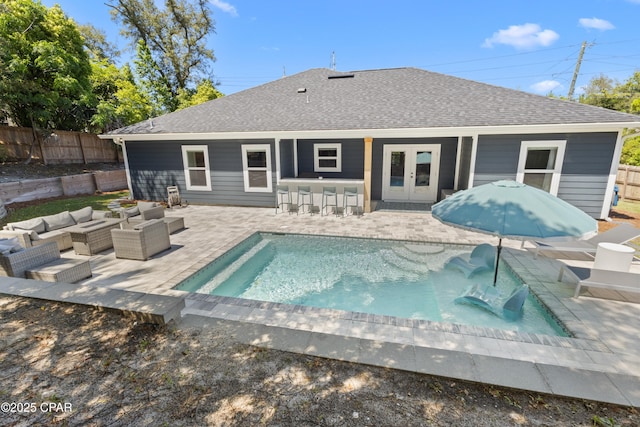 1106 E 3rd St, Panama City, FL 32401 - rear view of house featuring french doors, a fenced in pool, fence, a patio, and roof with shingles