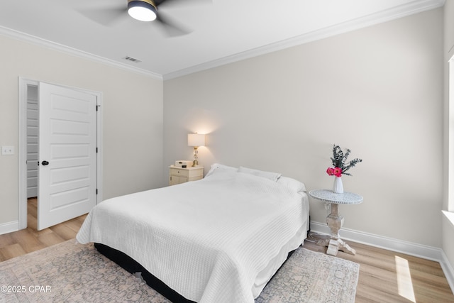 1106 E 3rd St, Panama City, FL 32401 - bedroom with visible vents, wood finished floors, baseboards, and ornamental molding